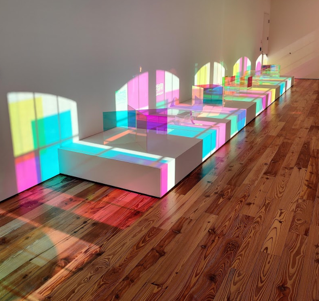 Gallery with colorful lighting.